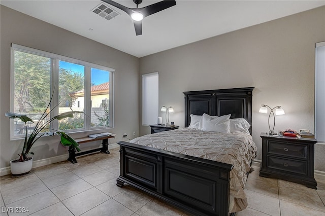 bedroom with light tile patterned flooring and ceiling fan