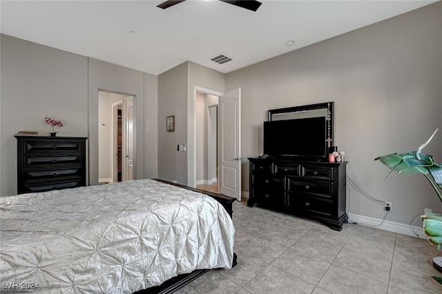 bedroom with light tile patterned floors and ceiling fan