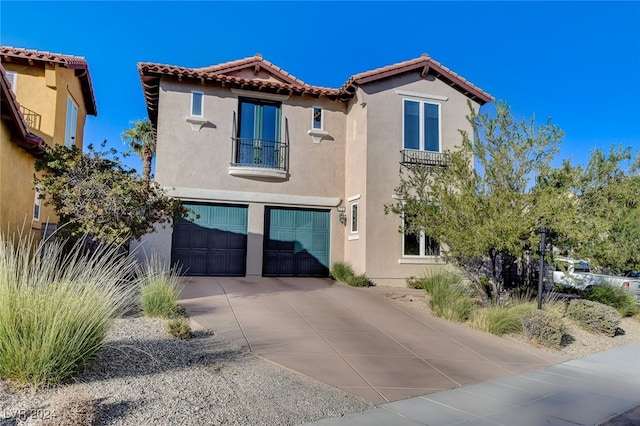 mediterranean / spanish-style home with a garage