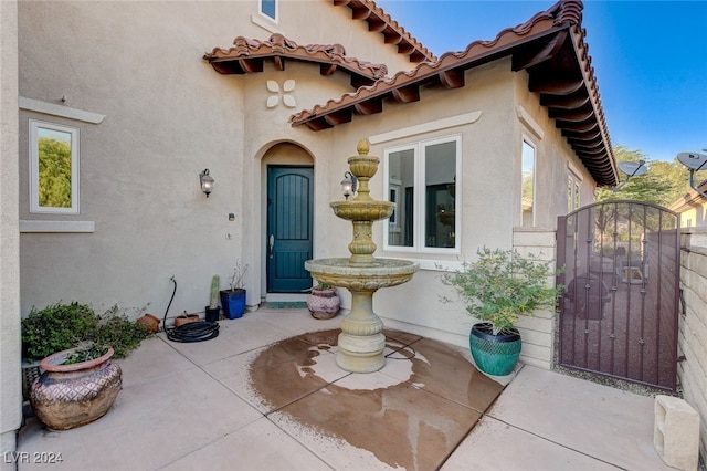 property entrance featuring a patio