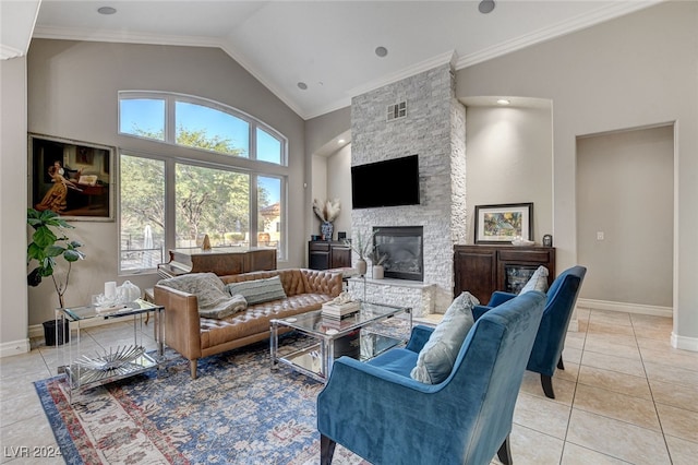 tiled living room featuring ornamental molding, a fireplace, and high vaulted ceiling