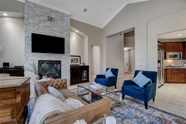 tiled living room featuring a stone fireplace, high vaulted ceiling, and crown molding