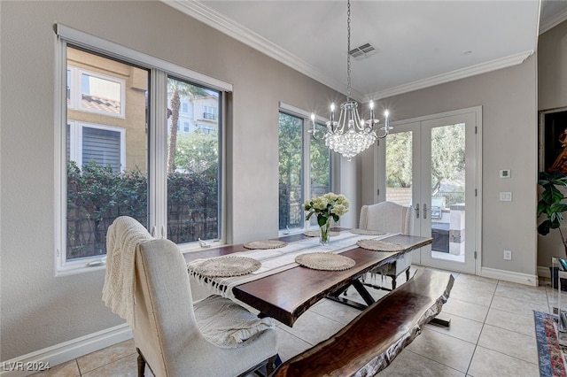 tiled dining room with a wealth of natural light, french doors, and ornamental molding