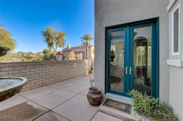 entrance to property featuring a patio area