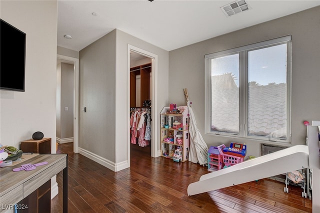 game room featuring dark hardwood / wood-style floors