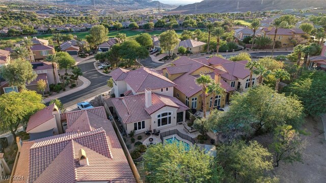 birds eye view of property with a mountain view