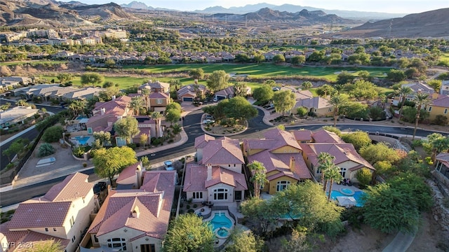 birds eye view of property with a mountain view