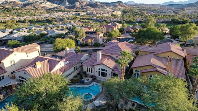 birds eye view of property featuring a mountain view