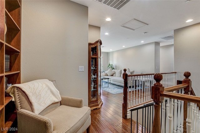 sitting room with hardwood / wood-style floors