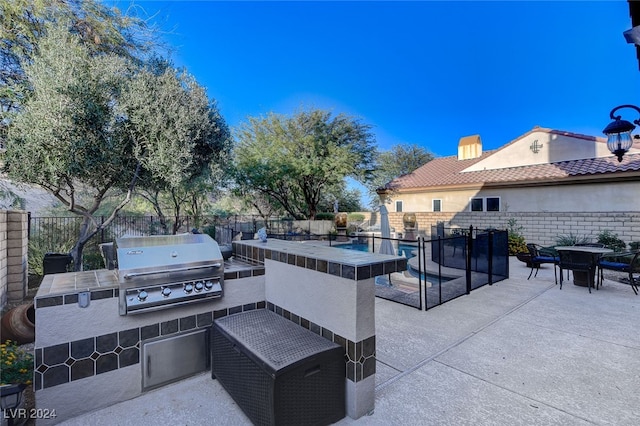 view of patio / terrace featuring an outdoor kitchen and area for grilling