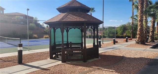 view of property's community with tennis court and a gazebo