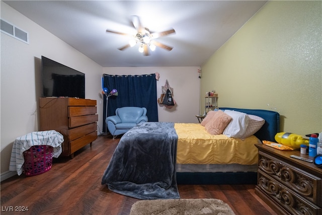 bedroom with dark wood-type flooring and ceiling fan