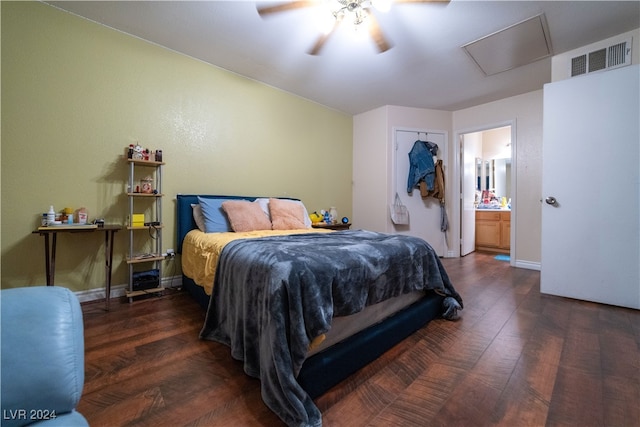 bedroom with a closet, ceiling fan, dark hardwood / wood-style flooring, and ensuite bath