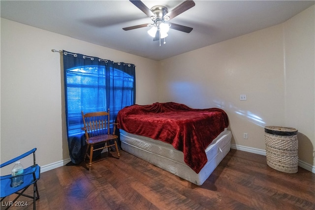 bedroom featuring ceiling fan and dark hardwood / wood-style flooring