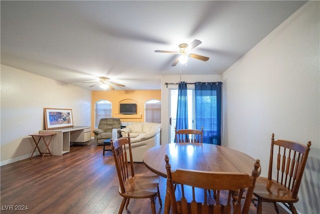 dining area with ceiling fan and dark hardwood / wood-style floors