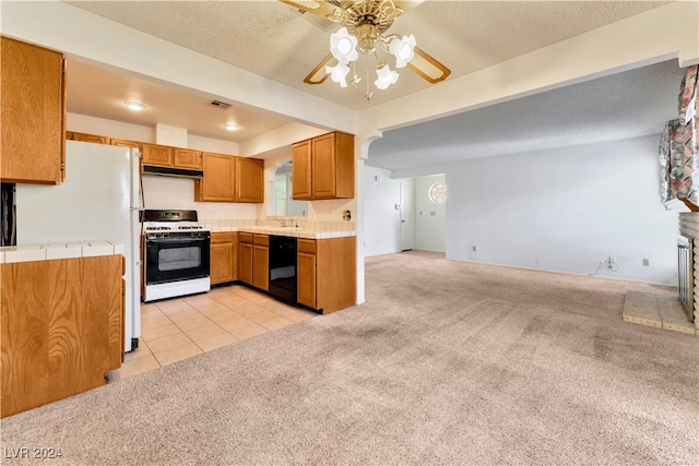 kitchen with white appliances, a textured ceiling, light carpet, and ceiling fan