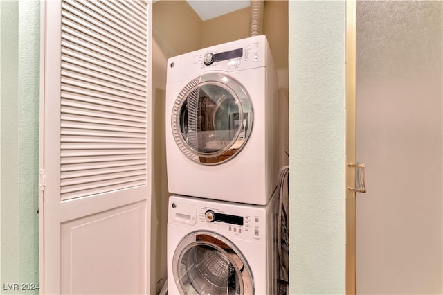 laundry room featuring stacked washer and dryer