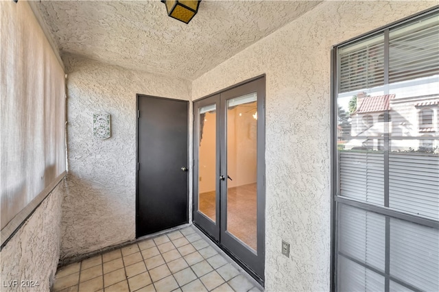 view of exterior entry featuring french doors