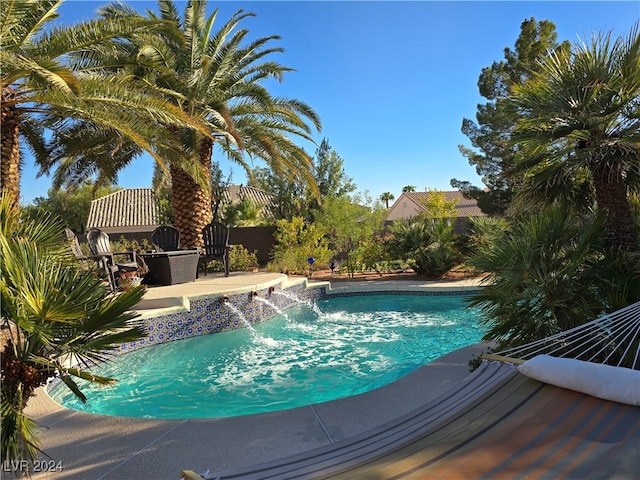 view of swimming pool featuring pool water feature