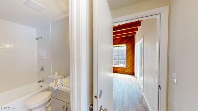 full bathroom with vanity, toilet, hardwood / wood-style floors, and shower / bath combination