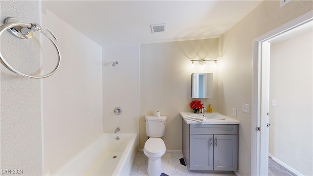 bathroom with vanity, toilet, and tile patterned flooring