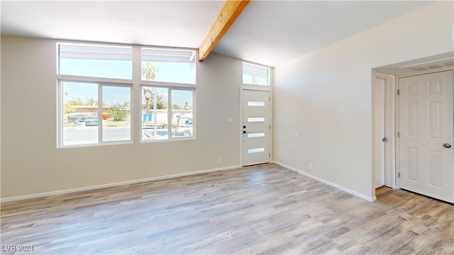 entryway featuring light wood-type flooring and beam ceiling