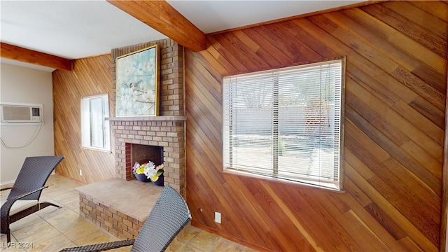 tiled living room featuring wood walls, a wealth of natural light, and beam ceiling