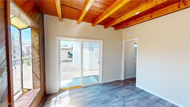 interior space featuring vaulted ceiling with beams, wooden ceiling, and hardwood / wood-style flooring