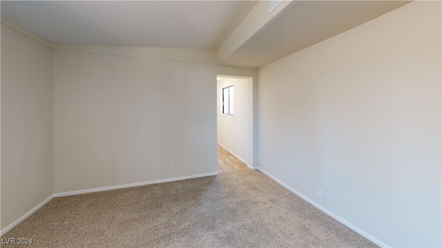 empty room featuring light colored carpet