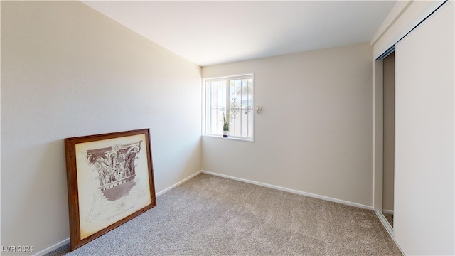 unfurnished bedroom with a closet and carpet