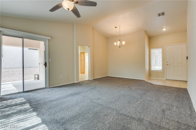 interior space with lofted ceiling, ceiling fan with notable chandelier, and light carpet