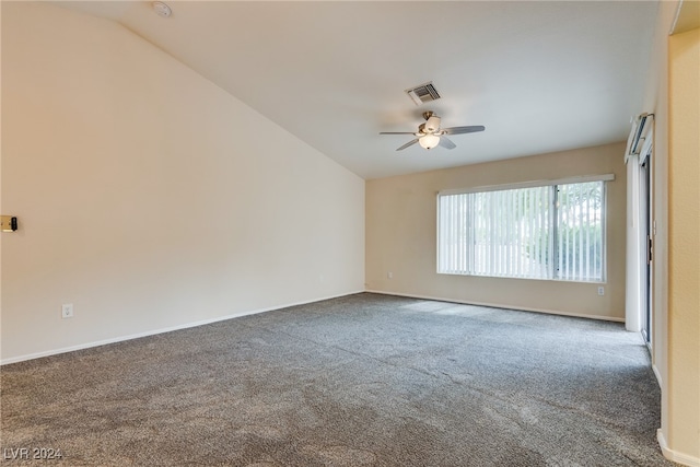 unfurnished room with lofted ceiling, ceiling fan, and carpet