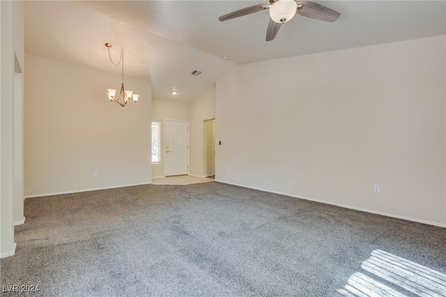 carpeted spare room with lofted ceiling and ceiling fan with notable chandelier