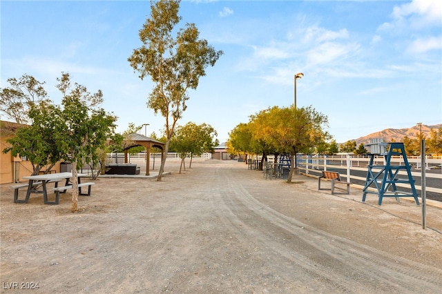 view of community with a mountain view and a gazebo