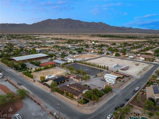 birds eye view of property with a mountain view