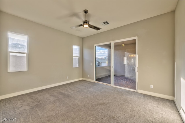 unfurnished bedroom featuring carpet flooring and ceiling fan