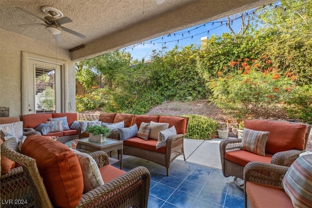 view of patio / terrace featuring ceiling fan and an outdoor living space