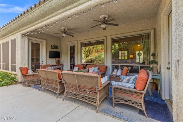 view of patio featuring an outdoor living space and ceiling fan