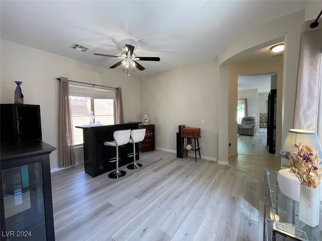 office featuring ceiling fan and light hardwood / wood-style floors