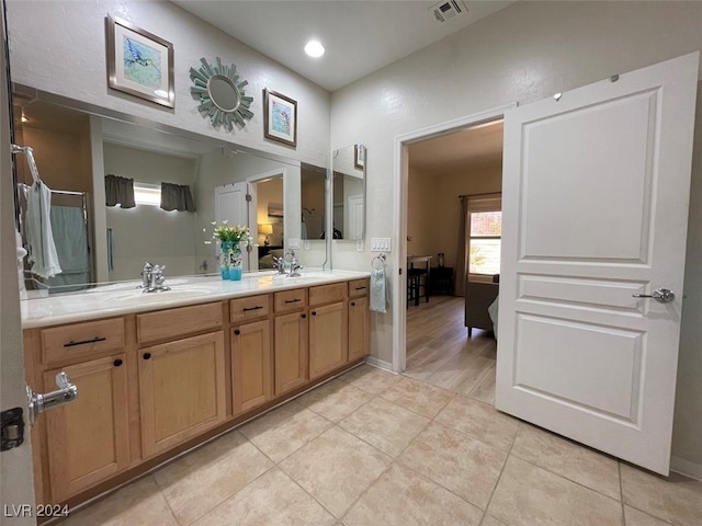 bathroom featuring vanity and hardwood / wood-style flooring