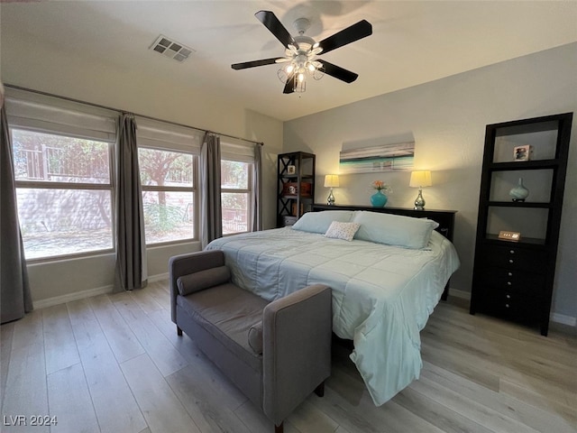 bedroom featuring light hardwood / wood-style flooring and ceiling fan