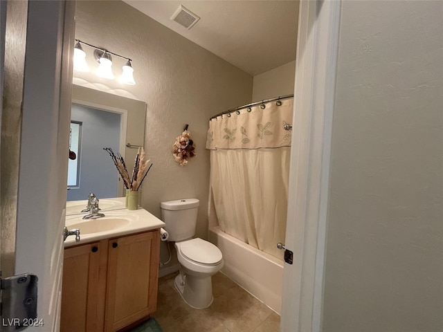 full bathroom featuring tile patterned floors, toilet, shower / tub combo with curtain, and vanity