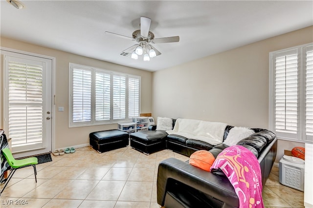 tiled living room featuring ceiling fan