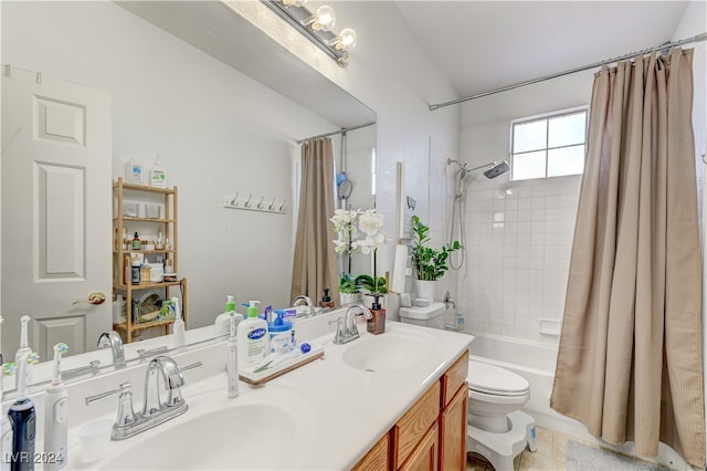 full bathroom featuring vanity, toilet, and shower / tub combo with curtain