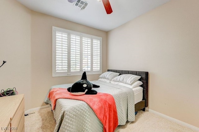 bedroom with light colored carpet and ceiling fan