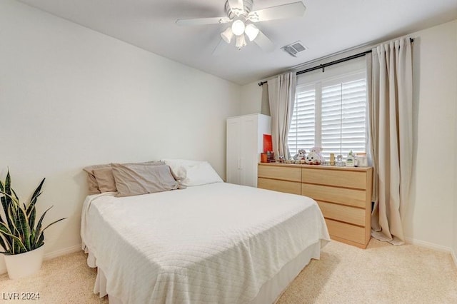 carpeted bedroom with ceiling fan