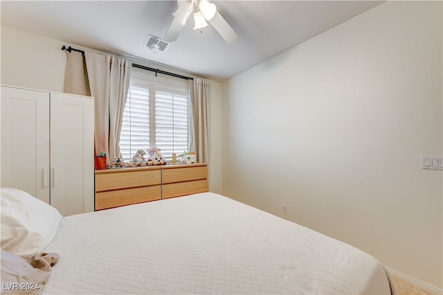 bedroom featuring ceiling fan and carpet floors