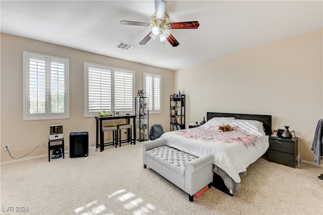 bedroom with light colored carpet and ceiling fan