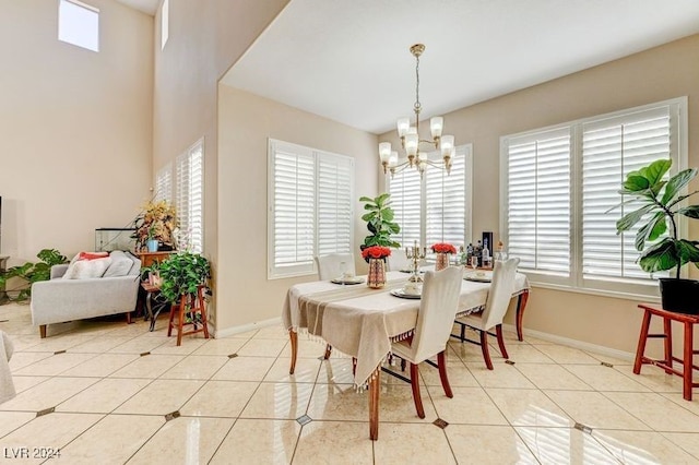 dining area with a healthy amount of sunlight, a notable chandelier, and light tile patterned floors