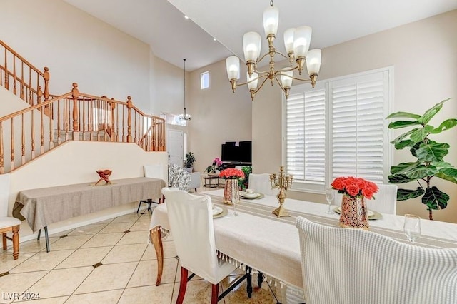 dining room featuring light tile patterned floors and a chandelier